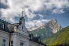 Slovenia, Bovec. House with Julian Alps in background. Art Print